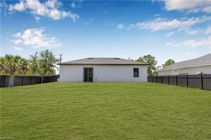 Back of property with stucco siding