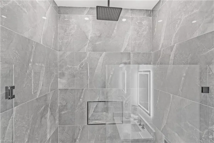 Bathroom view of a tile shower