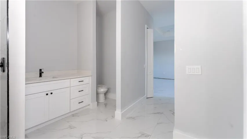 Bathroom with vanity and toilet