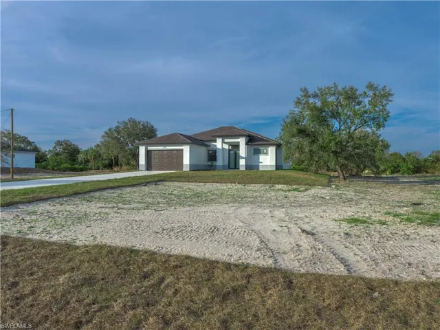 Single story home featuring a garage