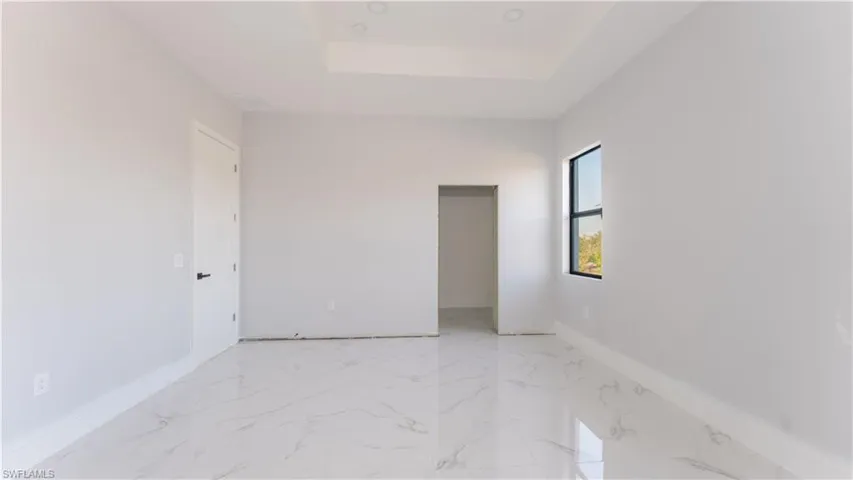 Unfurnished room with a skylight