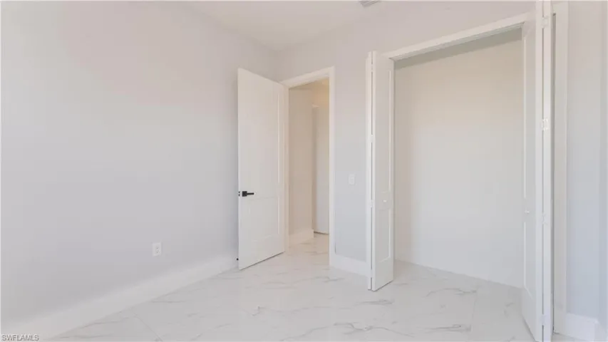 Unfurnished bedroom with a closet