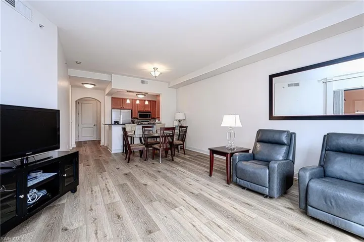 Living room with light hardwood / wood-style floors