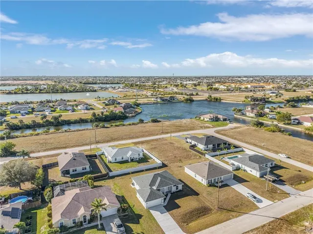 Aerial perspective of suburban area with a large body of water