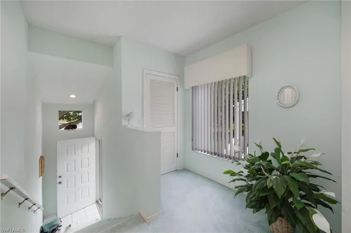 Wide Staircase and One of Two Storage Closets at the Top of the Stairs