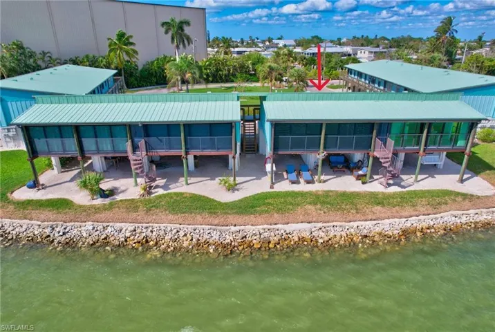 Back of property featuring a water view