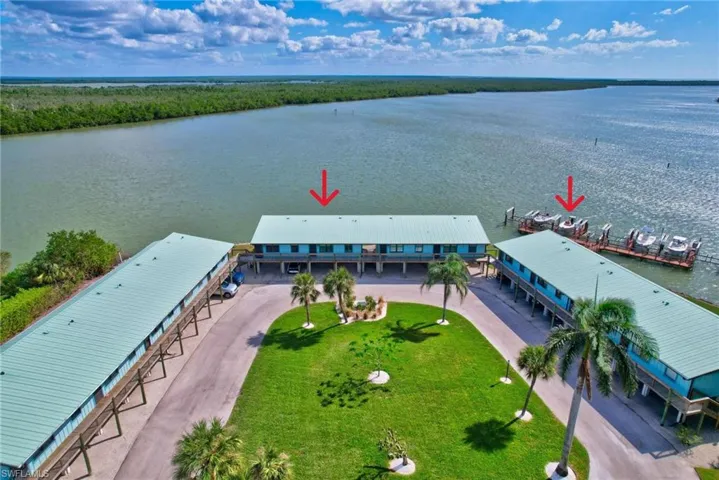 Bird's eye view of condo complex and private dock