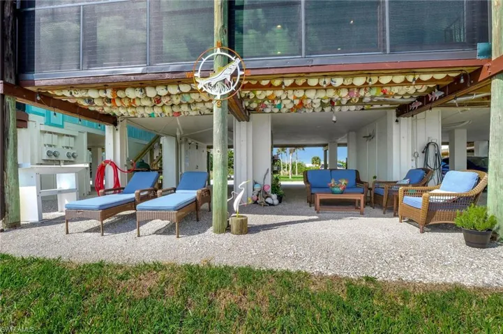 View of patio with outdoor lounge area, perfect setting for entertaining guests and grilling out.