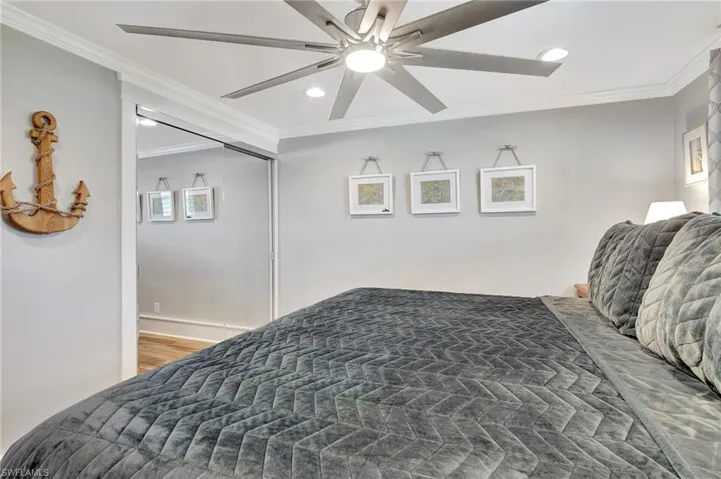 Bedroom featuring mirror closet doors