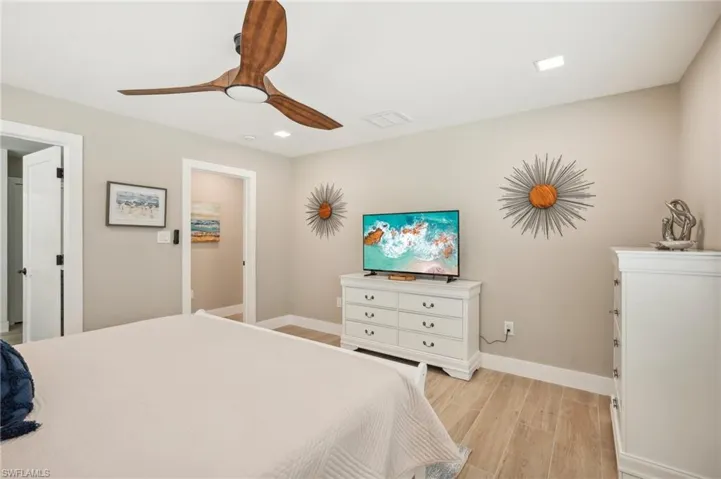 Bedroom featuring ceiling fan and light hardwood / wood-style floors