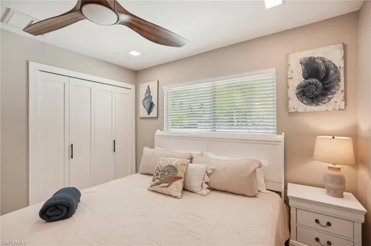 Bedroom featuring ceiling fan and a closet