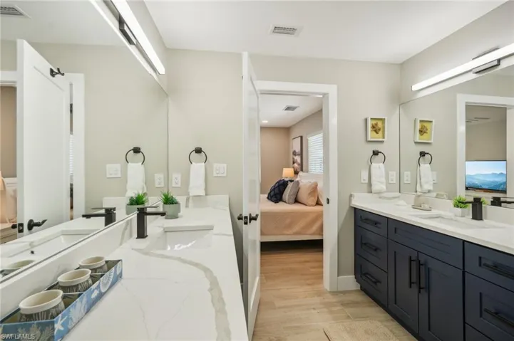 Bathroom with vanity and hardwood / wood-style floors