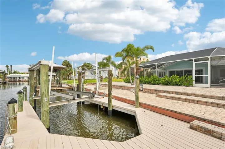 Dock area with a water view and a lanai