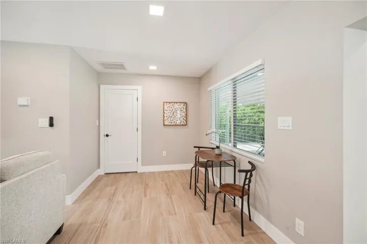 Home office featuring light hardwood / wood-style floors