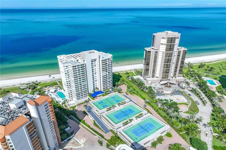 Bird's eye view of apartment complex / building and expansive coastline