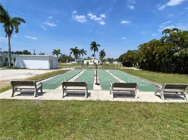 View of home's community with a yard