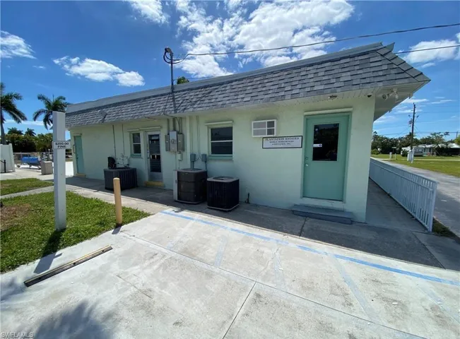 Rear view of house featuring central AC unit