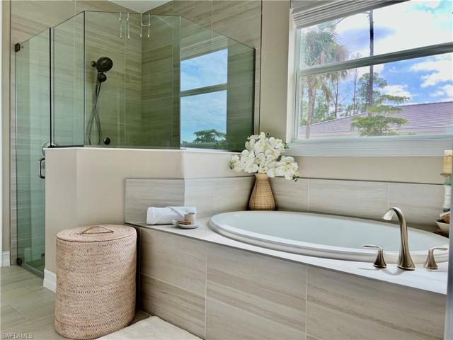 Primary Bathroom with Roman Tub and Separate Shower