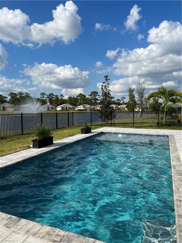 Heated salt water pool with sun ledge, bubbler, colored lighting and smart automation