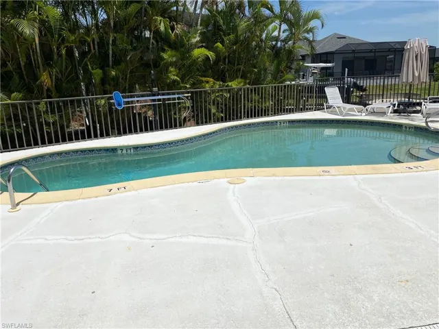 Community pool with a patio area