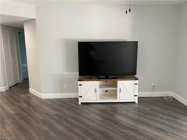 Detailed view of wood finished floors and baseboards