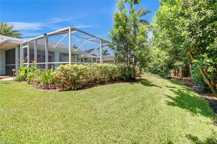 View of yard featuring a lanai