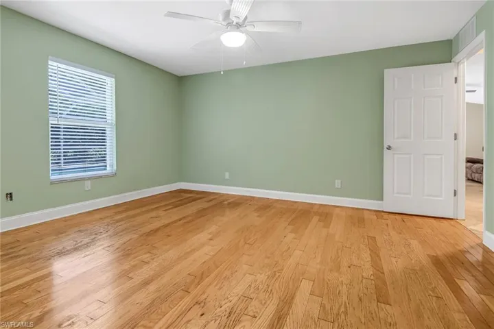 Spare room with light hardwood / wood-style floors and ceiling fan