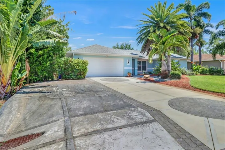 View of front of property with a garage
