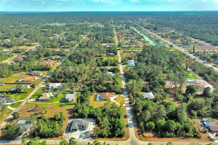 View of property location with nearby suburban area