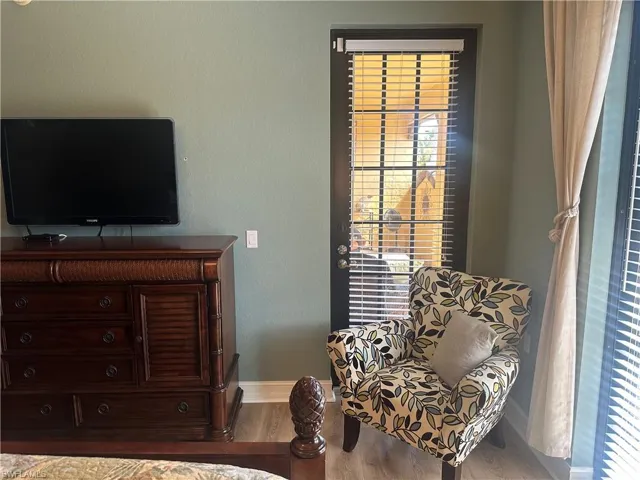 Sitting room featuring wood finished floors and baseboards