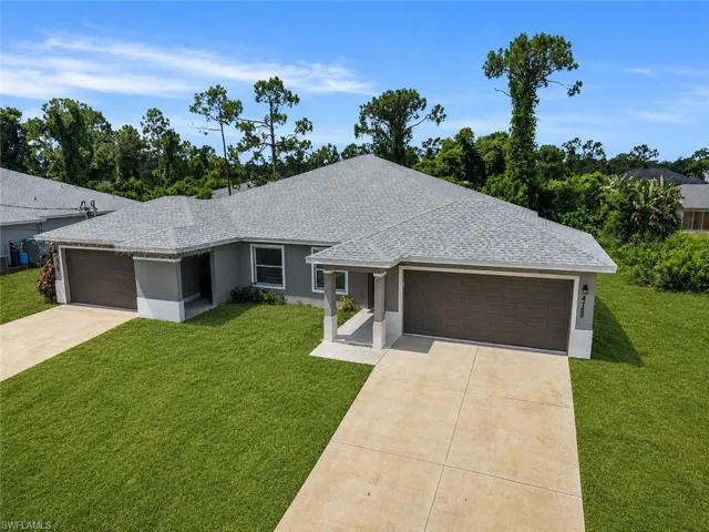 Contemporary stucco exterior with a gray tone and white trim