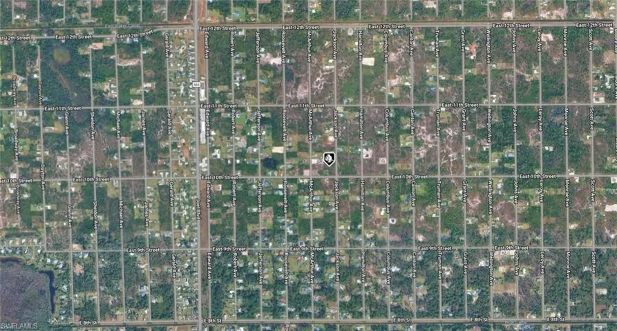 Aerial Property Map. Displaying the grid layout of streets and land parcels, with the property indicated by a marker