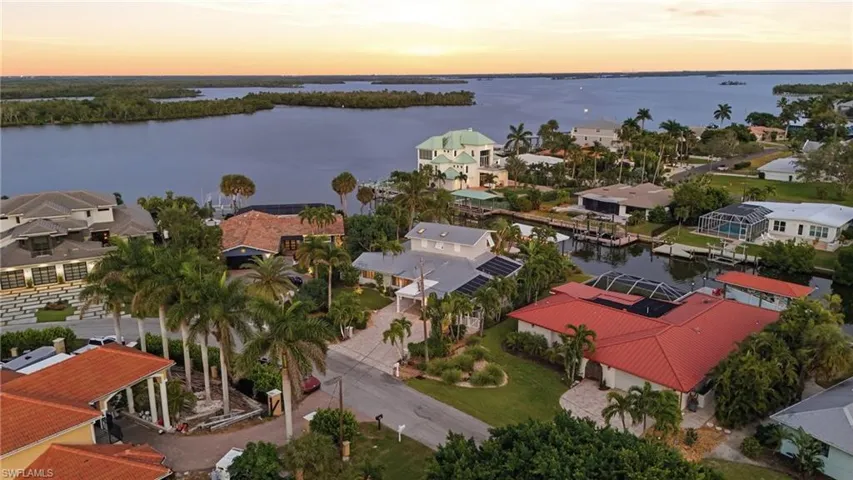 Aerial view at dusk of a residential view and a water view