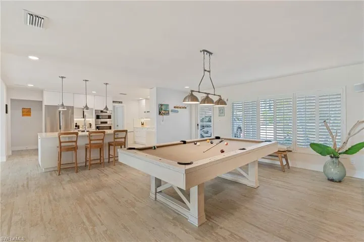 Game room featuring pool table and light wood look tile flooring