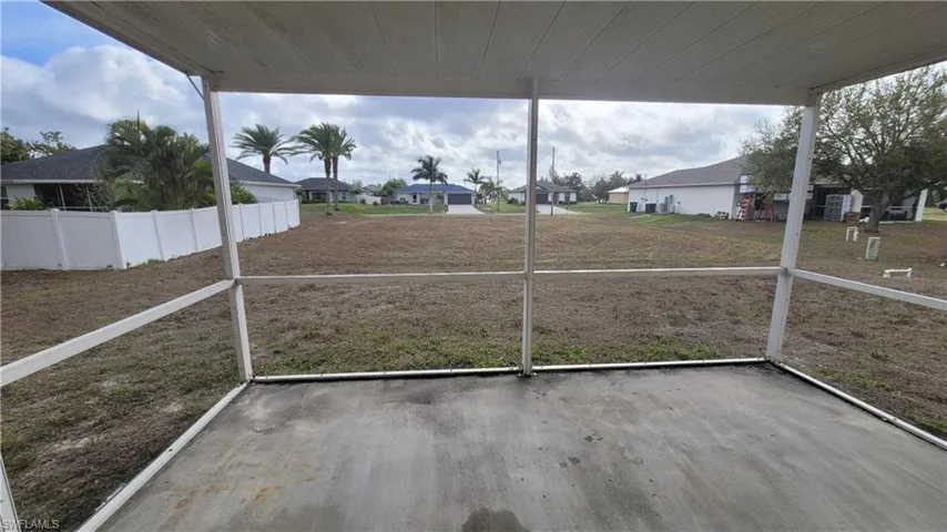 Unfurnished sunroom featuring a residential view