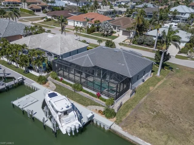 Aerial view with a water view and a residential view