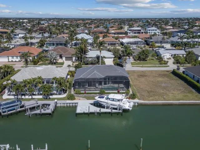 Birds eye view of property featuring a residential view and a water view
