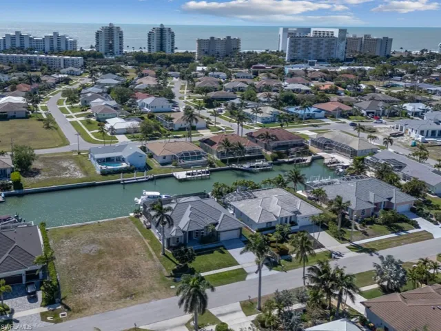 Birds eye view of property featuring a residential view and a water view