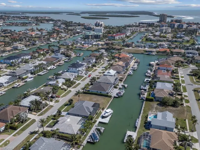 Birds eye view of property featuring a residential view and a water view