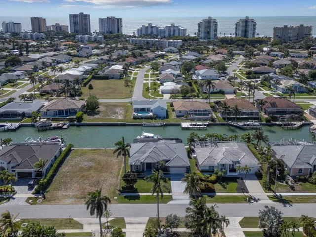 Drone / aerial view with a residential view and a water view