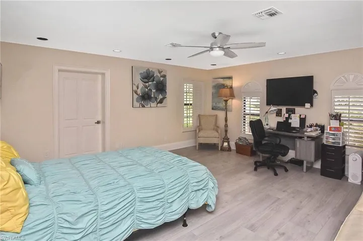 Bedroom featuring light wood-type flooring and ceiling fan