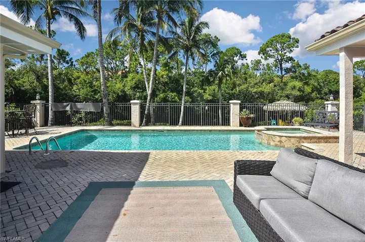 View of pool featuring a patio area and an in ground hot tub