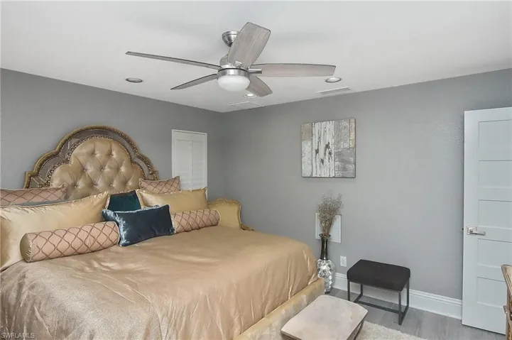 Bedroom featuring hardwood / wood-style flooring and ceiling fan