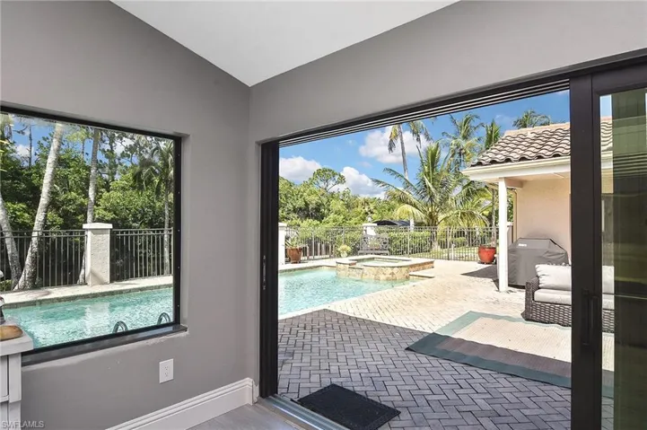 View of pool with area for grilling