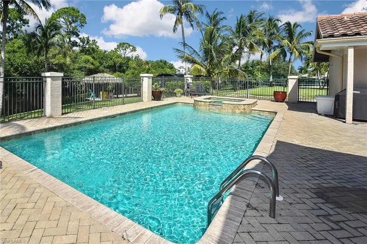View of pool featuring an in ground hot tub and a patio