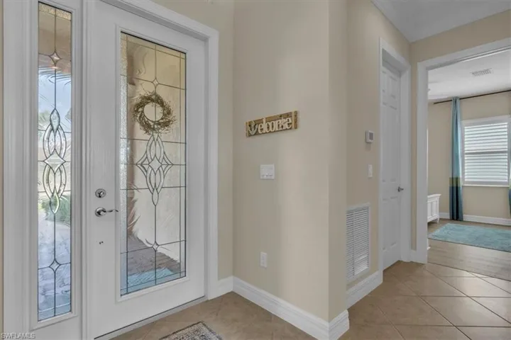 Laundry room between entry and guest bedroom