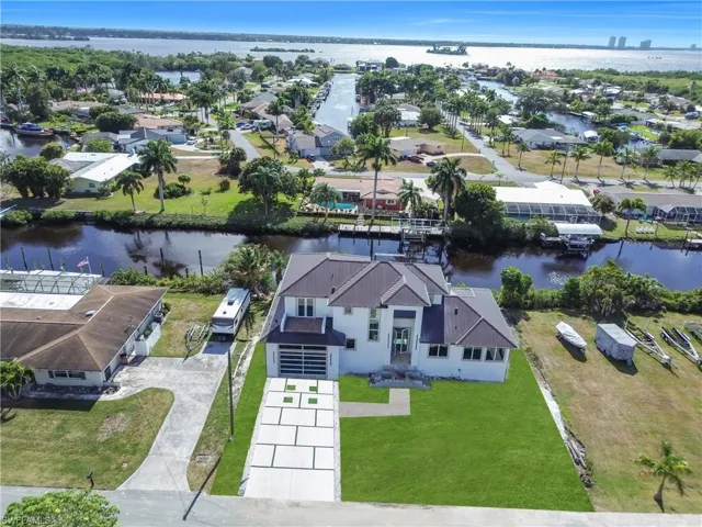 Aerial view of residential area with a nearby body of water