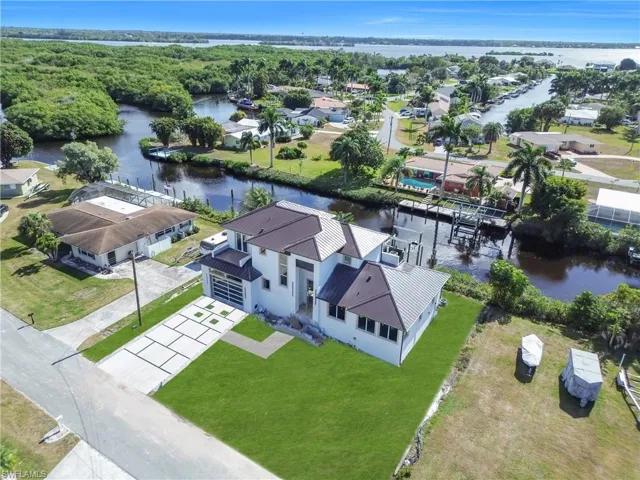 Aerial perspective of suburban area with a nearby body of water