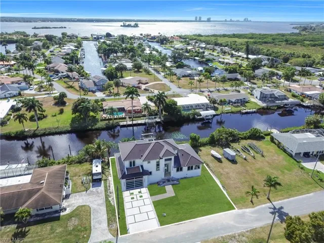 Aerial view of residential area with a large body of water