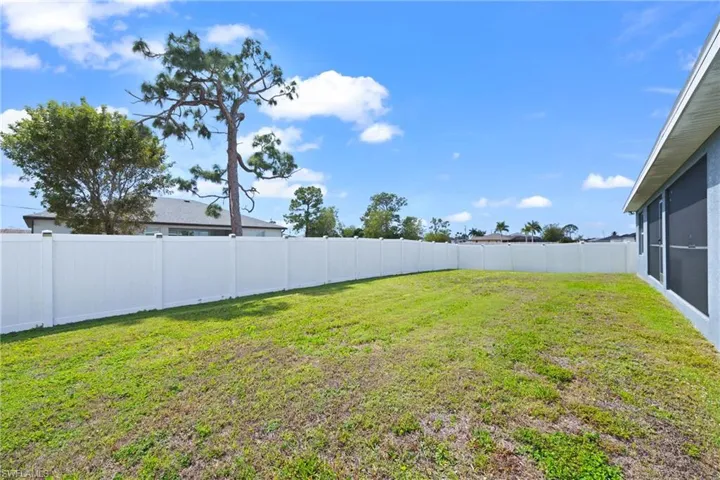 View of fenced backyard